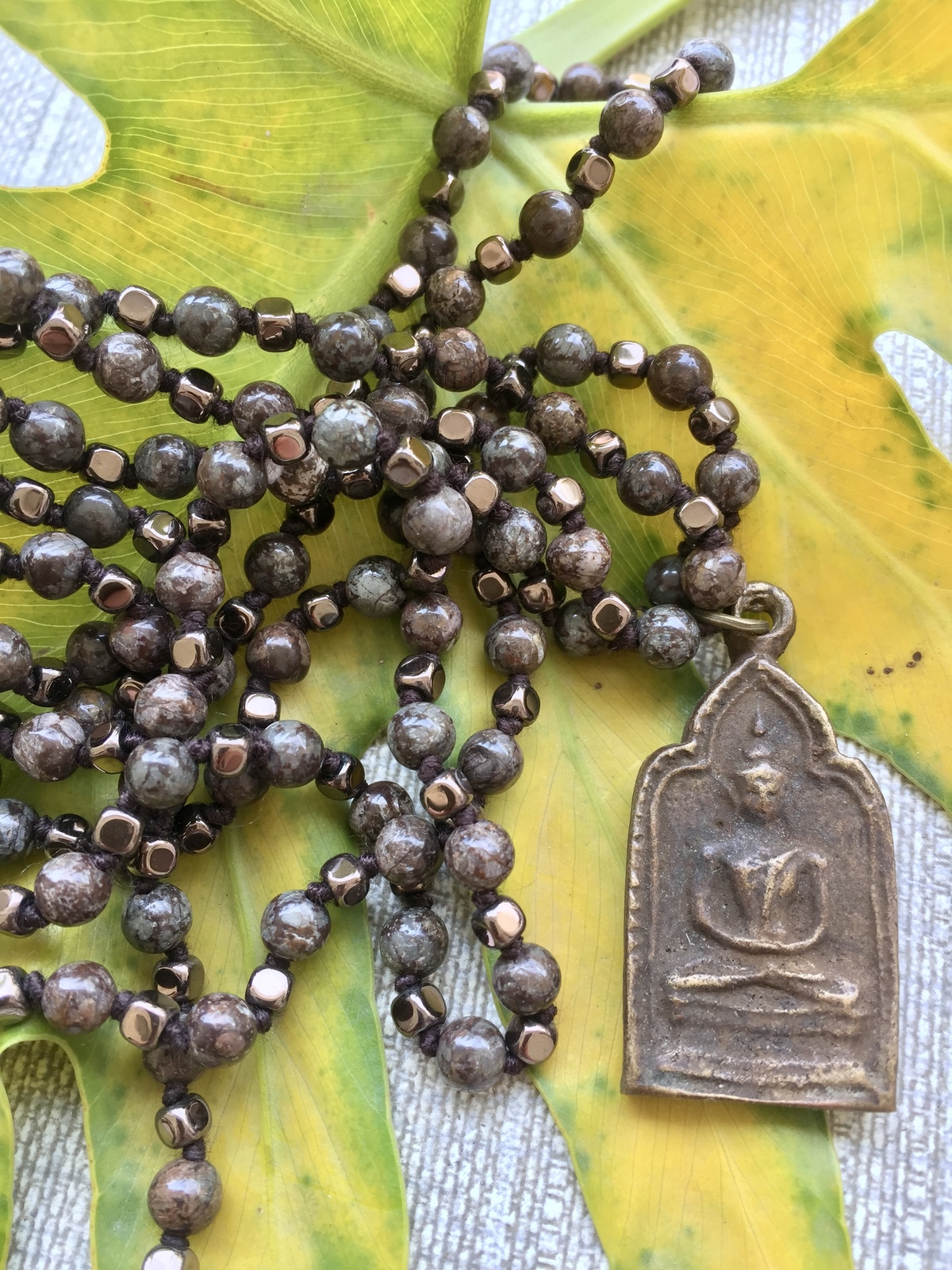 buddha grounding necklace made with warm brown jasper and faceted bronze hematite beads, featuring an antique bronze thai buddha amulet symbolizing grounding, mindfulness, and inner stability