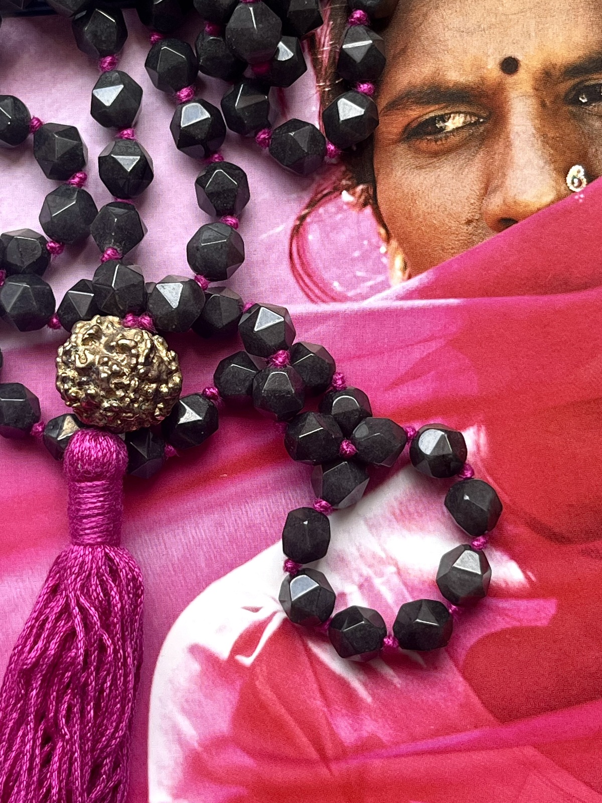 golden rudra necklace with 108 dark grey agate beads, fuchsia tassel, and gold-dipped rudraksha beads, spiritual handmade jewelry from india