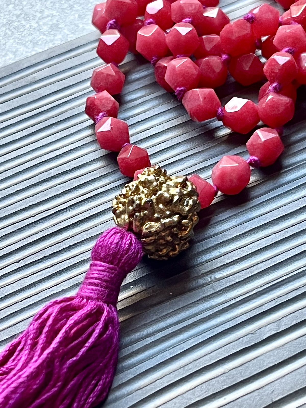golden rudra necklace with 108 hot pink agate beads, fuchsia tassel, and gold-dipped rudraksha beads, spiritual handmade jewelry from india