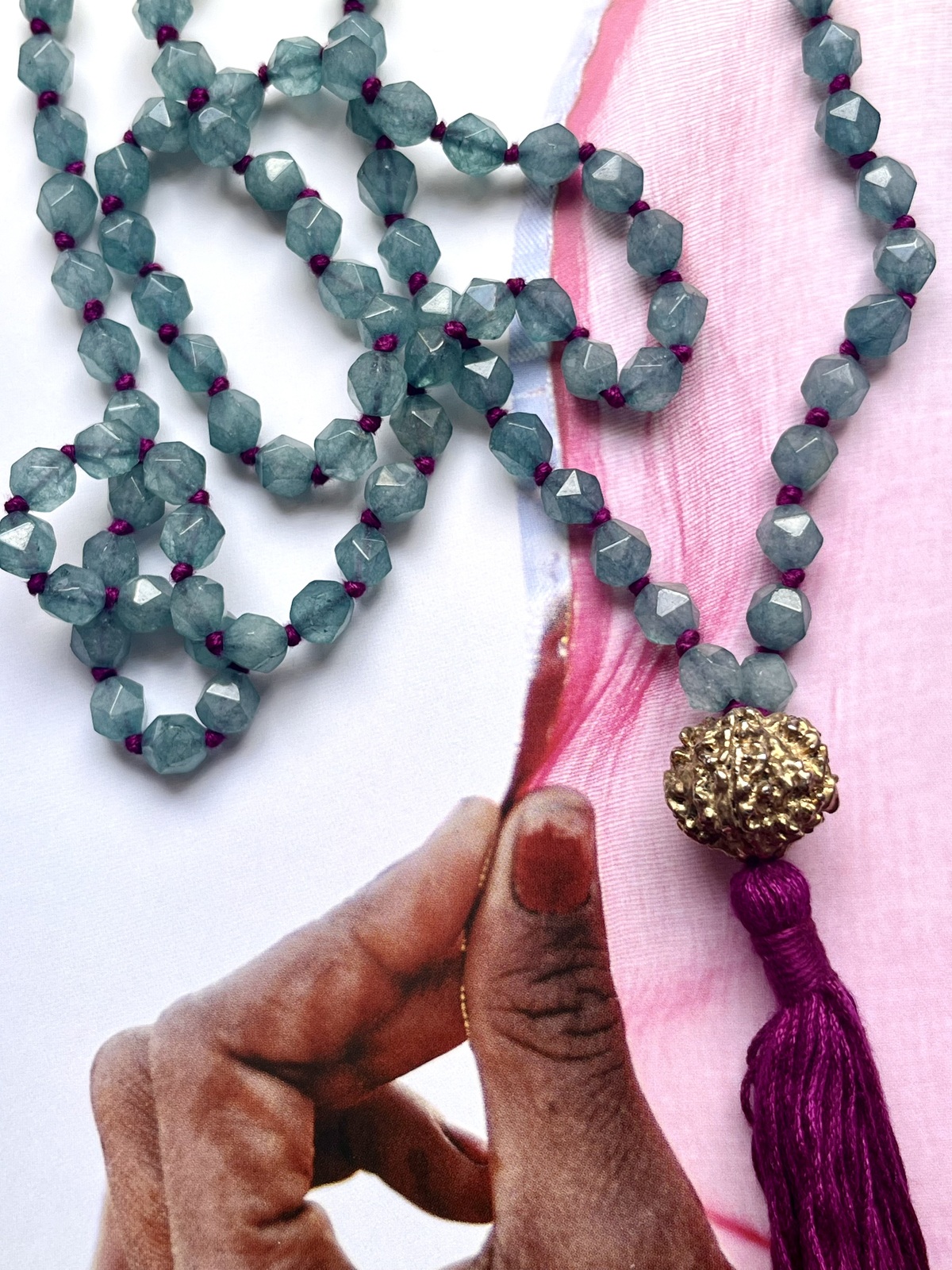 golden rudra necklace with 108 light blue agate beads, fuchsia tassel, and gold-dipped rudraksha beads, spiritual handmade jewelry from india