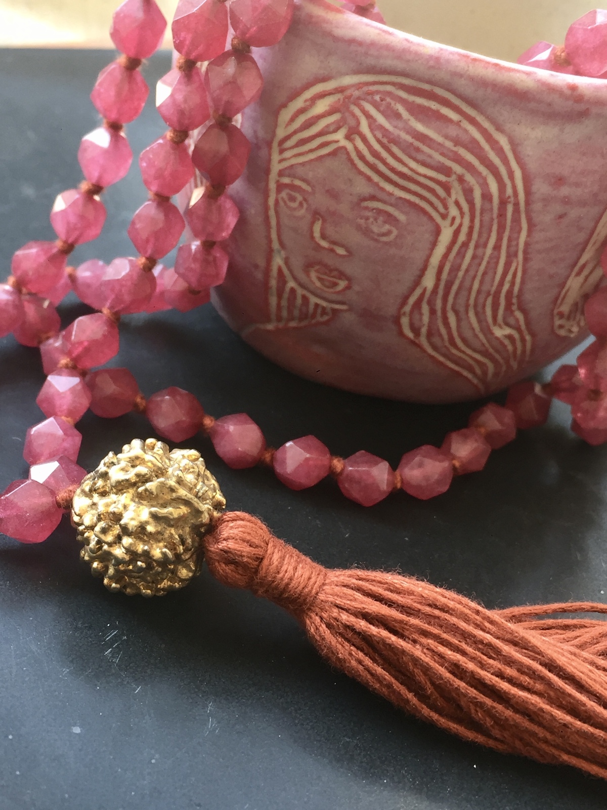golden rudra necklace with 108 ruby agate beads, orange tassel, and gold-dipped rudraksha beads, spiritual handmade jewelry from India
