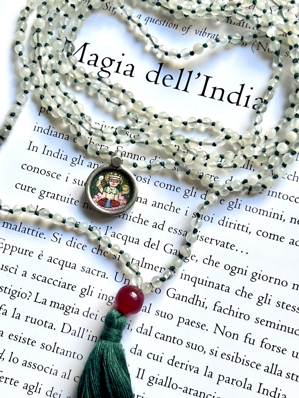 hand-painted tiny laxmi miniature silver pendant with moonstone and green tassel double mala