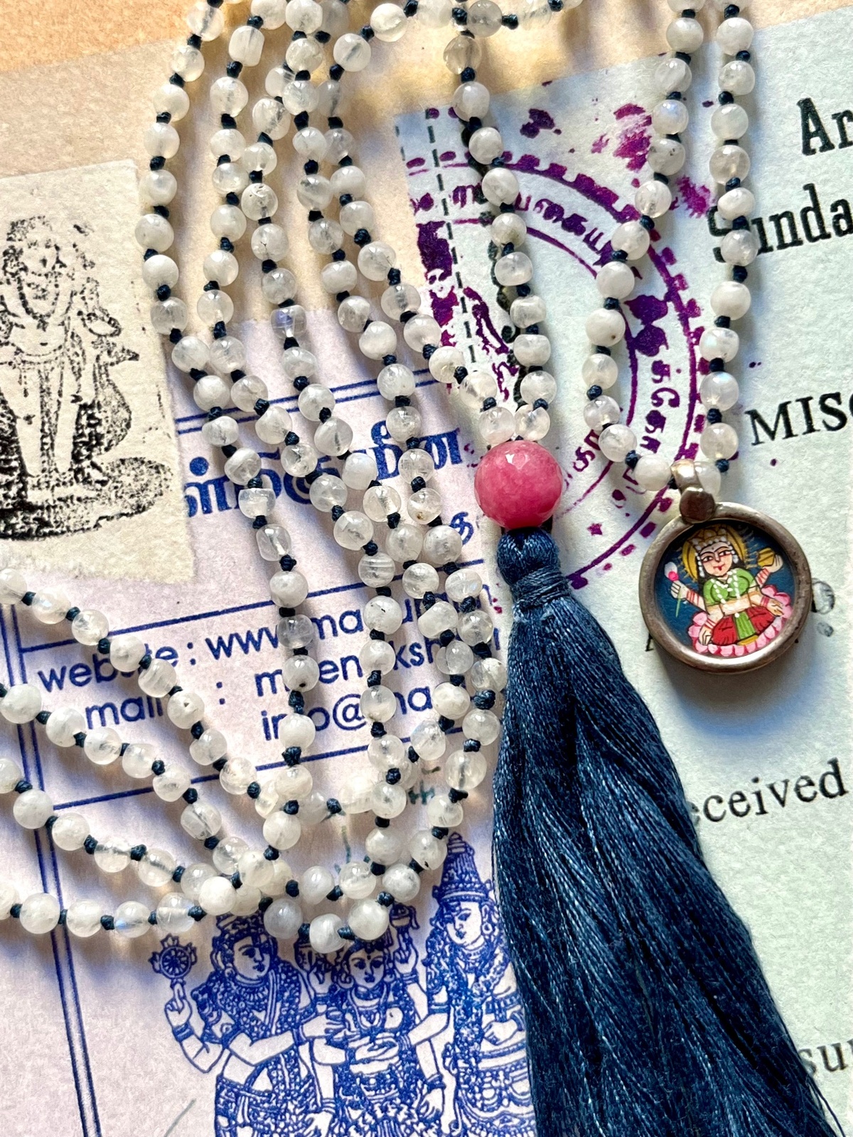 hand-painted tiny laxmi miniature silver pendant with moonstone and blue tassel double mala