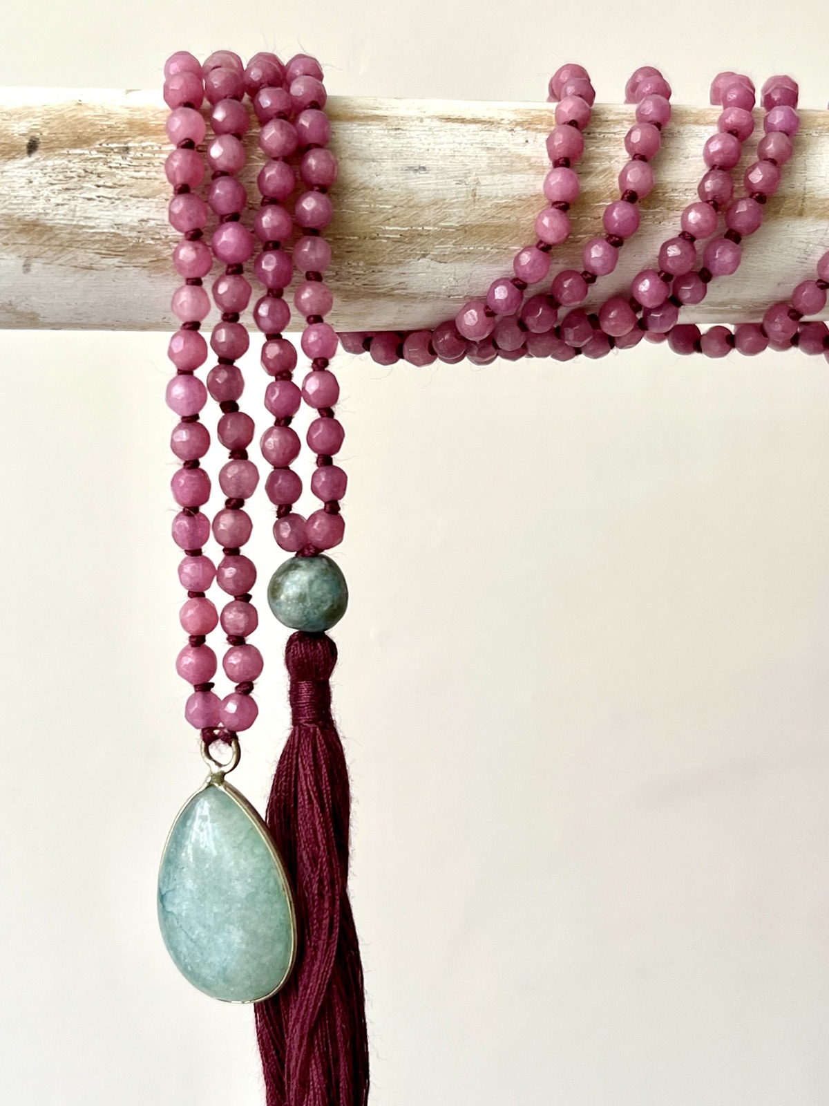 adjustable double mala necklace with hand-knotted pink agate beads and a green jade pendant, symbolizing harmony, balance, and gentle vitality